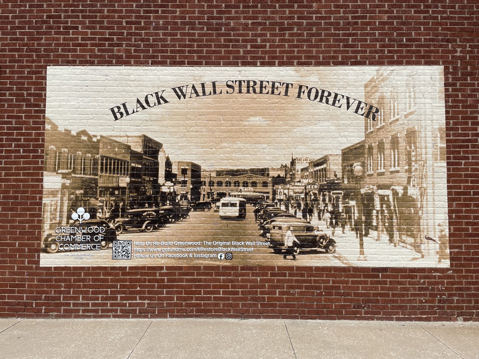 A Look Inside the Greenwood Rising Museum black wall street forever sign in Greenwood