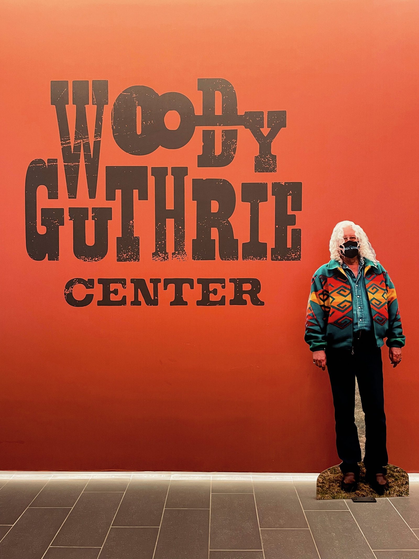 Celebrating an American Icon at the Woody Guthrie Center entrance at the Woody Guthrie Center