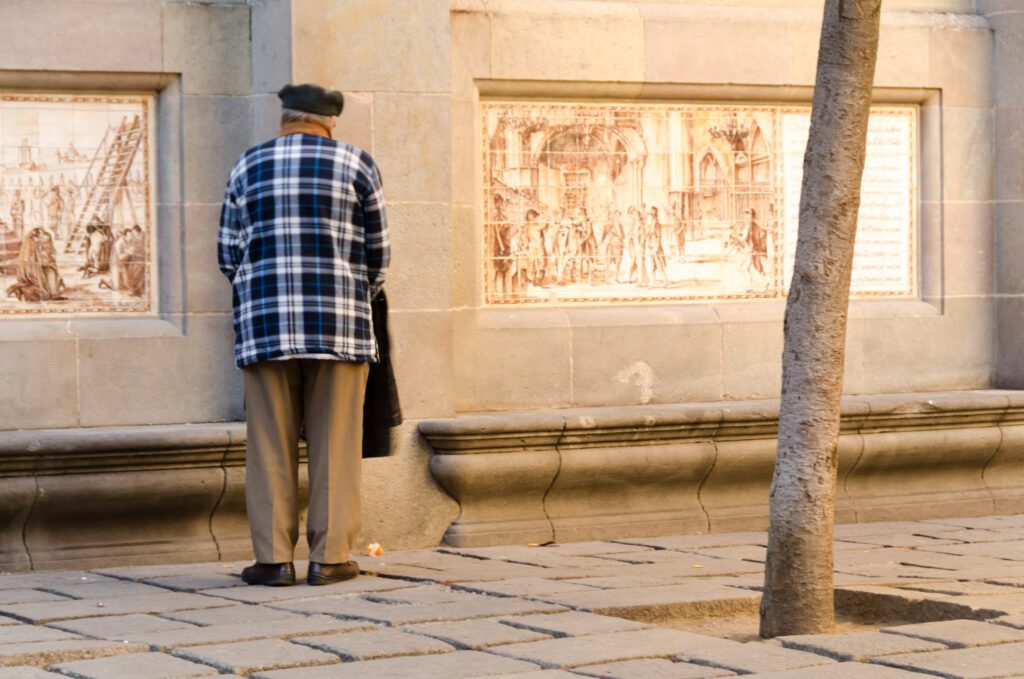 man standing along in street Barcelona Spain, Spain travel photography