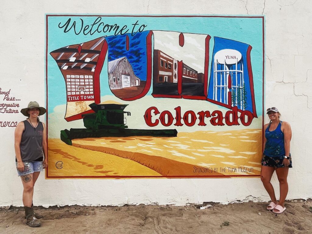 some girls and a mural map, Yuma Colorado