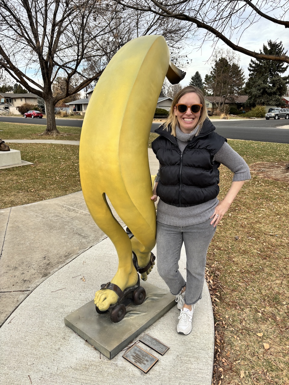 posing with the banana sculpture in Loveland