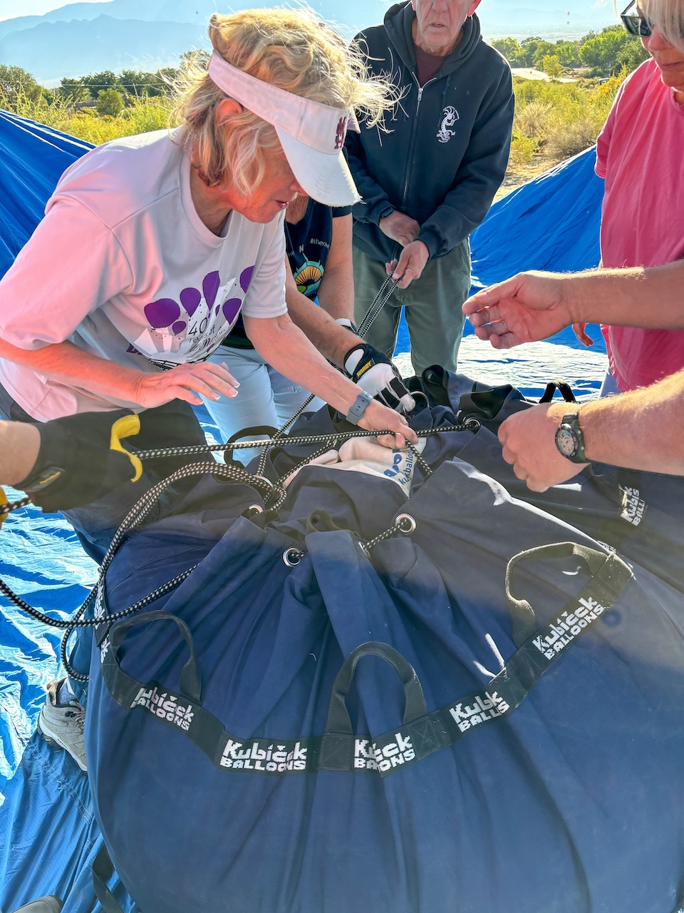 pilot and crew dismantling hot air balloon