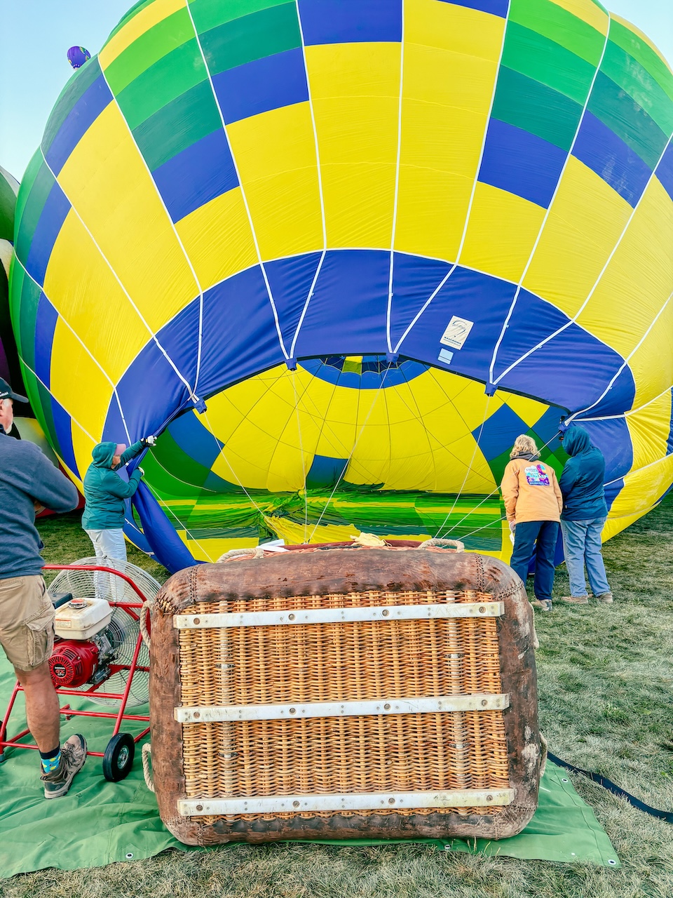 pilot and crew inflating hot air balloons